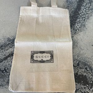Gucci burlap gift bag with Gucci, green tissue paper